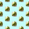 pattern sandwiches with pieces of fresh avocado on a blue background flat lay