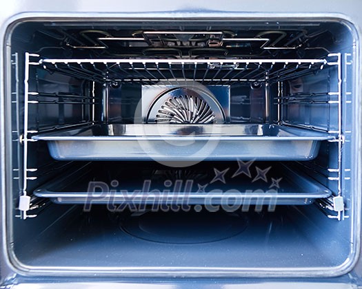 Detail of the interior of a modern oven built with fan Detail of the interior of a modern oven built with fan