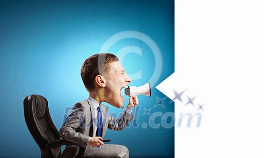 Funny young man with big head screaming emotionally in megaphone Funny young man with big head screaming emotionally in megaphone