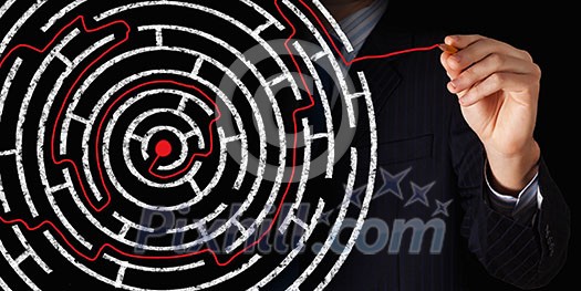 Close up of businessman drawing way out of labyrinth Close up of businessman drawing way out of labyrinth