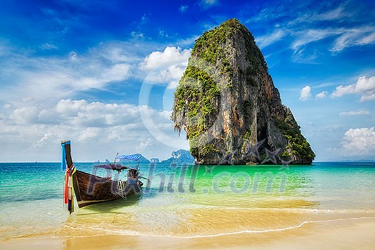 Tropical vacation holiday tourism beach concept - Long tail boat on tropical beach, Krabi, Thailand Tropical vacation holiday tourism beach concept - Long tail boat on tropical beach, Krabi, Thailand