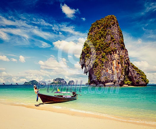 Thailand tropical vacation concept background - Vintage retro effect filtered hipster style image of long tail boat on tropical beach with limestone rock, Krabi, Thailand Thailand tropical vacation concept background - Vintage retro effect filtered hipster style image of long tail boat on tropical beach with limestone rock, Krabi, Thailand