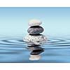 Zen stones in water with reflection - peace balance meditation relaxation concept