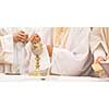 Priest during a wedding ceremony/nuptial mass (shallow DOF; color toned image)