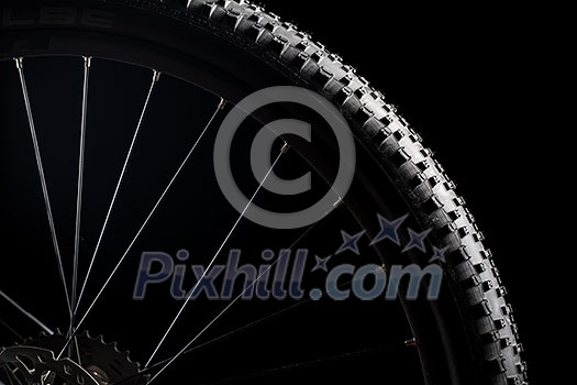 Modern MTB race mountain bike isolated on black background in a studio Modern MTB race mountain bike isolated on black background in a studio