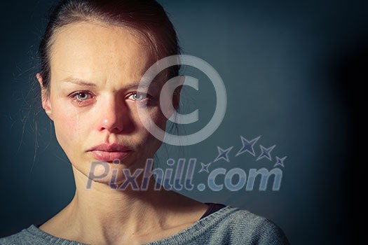 Young woman suffering from severe depression/anxiety/sadness