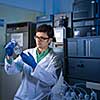 Senior male researcher carrying out scientific research in a lab (shallow DOF; color toned image)