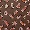 Homemade Gingerbread cookies with different shapes isolated on a brown background. Christmas background