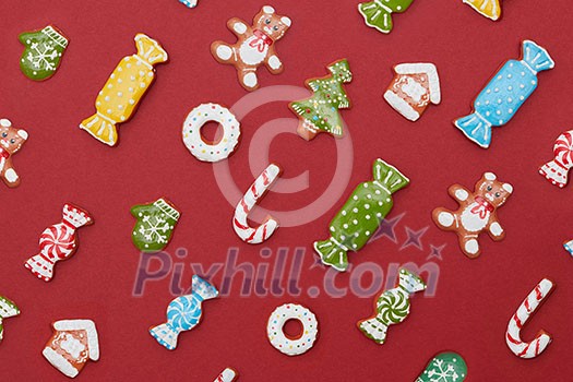 Christmas background. Christmas Gingerbread Cookies on a red background. Christmas background. Christmas Gingerbread Cookies on a red background.