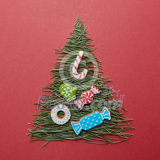 Christmas tree made of pine needles with the decoration of Christmas cookies. Postcard Happy New Year. Christmas tree made of pine needles with the decoration of Christmas cookies. Postcard Happy New Year.
