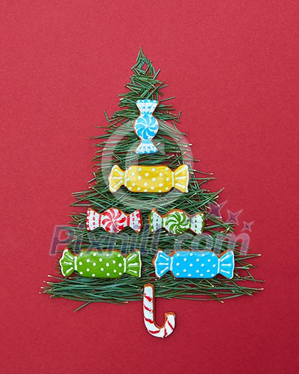 Christmas card with fir-tree needles and sweets of Christmas cookies. Postcard Happy New Year. Christmas card with fir-tree needles and sweets of Christmas cookies. Postcard Happy New Year.