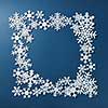 Frame of Christmas snowflakes on blue background