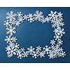 Christmas decorative frame of snowflakes. On a blue background.