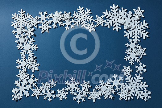 Blue background with space for text and snowflakes.