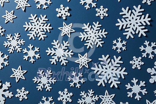 Winter, Christmas or New Years blue background with snowflakes