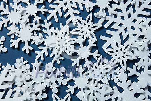 Snowflakes on a blue background. Christmas winter background