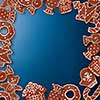 Frame of homemade gingerbread cookies on a blue background
