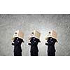 Unrecognizable business people with carton boxes on head