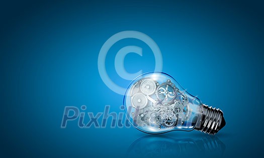 Conceptual image of light bulb with cogwheels inside