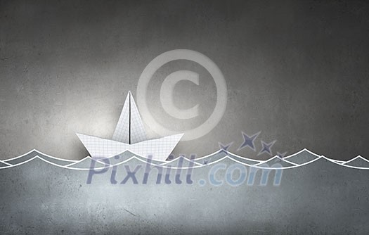 Paper ship floating on water on waves Paper ship floating on water on waves
