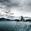 Paper ship floating on water on stormy waves