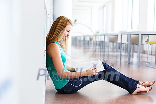 pretty young college student in a library (shallow DOF; color toned image) pretty young college student in a library (shallow DOF; color toned image)