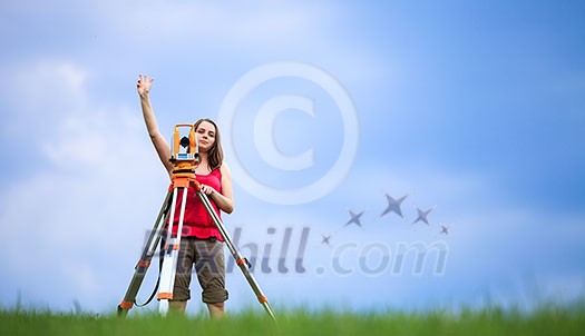 Young land surveyor at work
