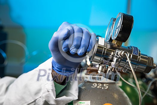 Hands of a researcher carrying out scientific research in a lab