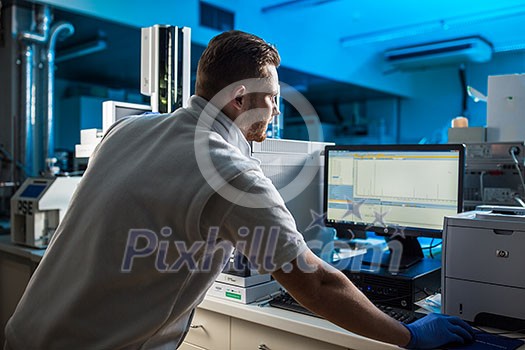 Senior male researcher carrying out scientific research in a lab (shallow DOF; color toned image) Senior male researcher carrying out scientific research in a lab (shallow DOF; color toned image)