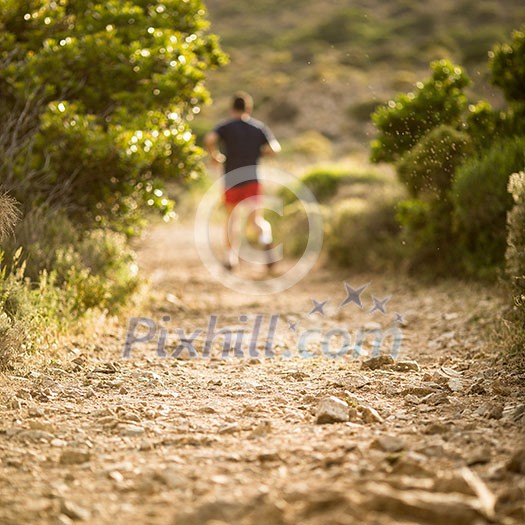 Young man running outdoors on a lovely sunny day