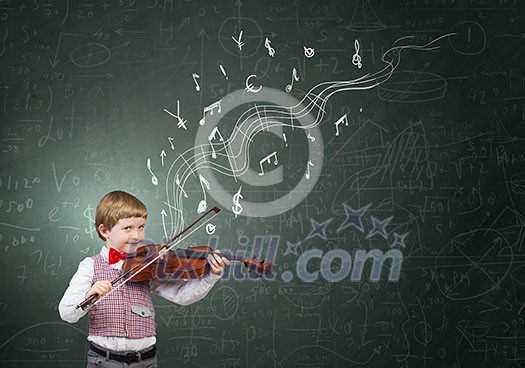 Adorable boy wearing red bowtie and playing violin