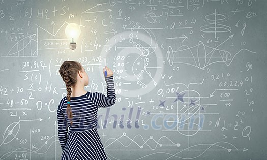 Cute girl of school age and blackboard on background Cute girl of school age and blackboard on background