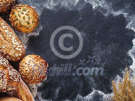 Assortment of fresh bread on the table. Copyspace for text.