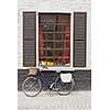 Retro bicycle standing near the old window, Belgium