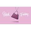 a label in shape of the classic womens handbag made of cardboard on a purple background. calligraphic text is black Friday. The concept of sales