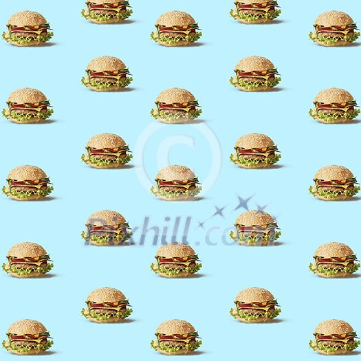 pattern of fly hamburgers with vegetables on a blue texture. can be used as a background for your ideas