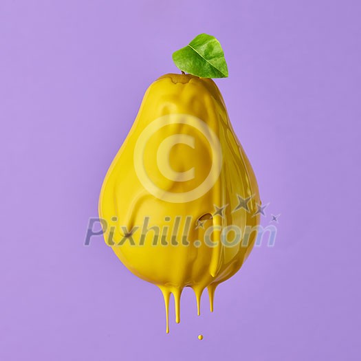 pear with a green leaf and with a flowing yellow paint on a purple background pear with a green leaf and with a flowing yellow paint on a purple background