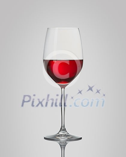 red wine in a glass isolated on a gray background