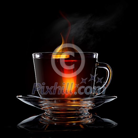 glass cup with tea and saucer isolated on black background close-up glass cup with tea and saucer isolated on black background close-up