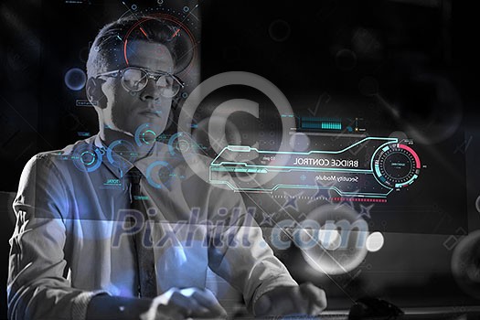 Young man working on computer at night in dark office. The designer works in the later time.