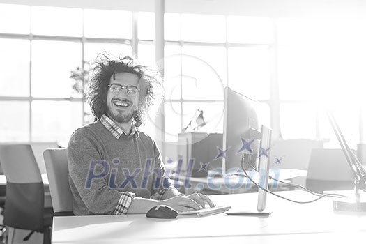 Young Entrepreneur Freelancer Working Using A computer In Coworking space Young Entrepreneur Freelancer Working Using A computer In Coworking space