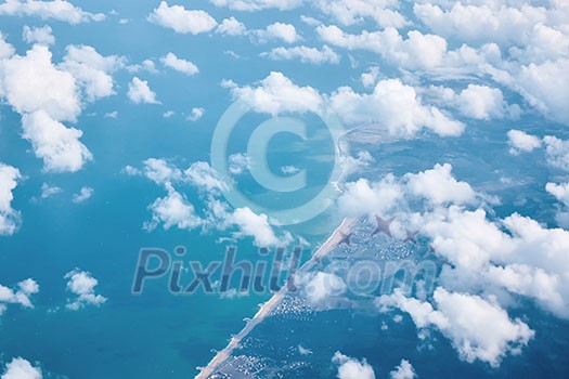 white clouds and view of the city from the aerial