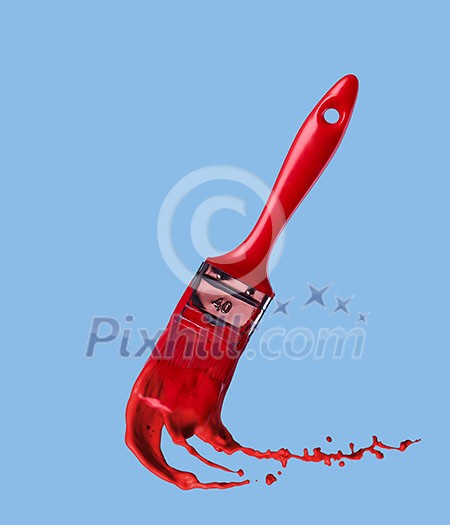 splashes of red paint and brush on a blue background splashes of red paint and brush on a blue background