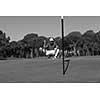golf player aiming shot with club on course at beautiful sunny day