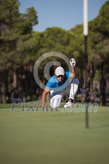golf player aiming shot with club on course at beautiful sunny day golf player aiming shot with club on course at beautiful sunny day