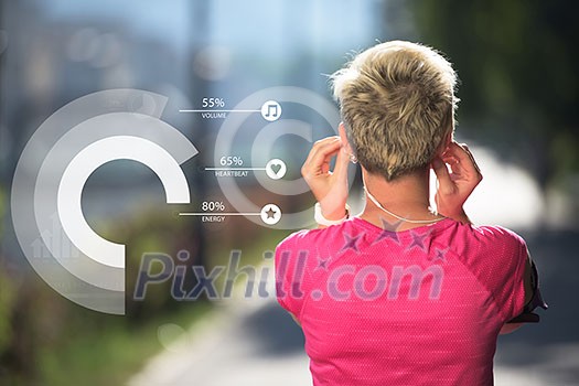 Young fit woman take a break from training and get earphones to listen music Young fit woman take a break from training and get earphones to listen music