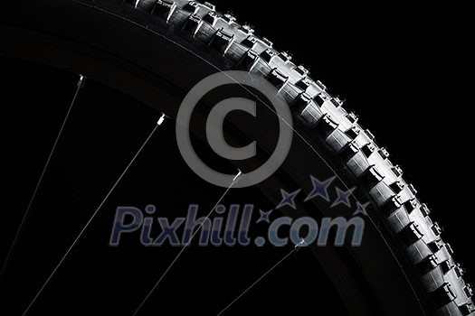 Modern MTB race mountain bike isolated on black background in a studio