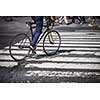 Man on a bike on a crossing in Manhattan, NYC