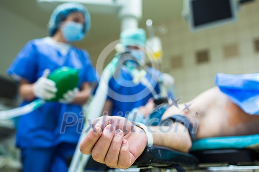 Unidentified boy undergoing a surgery. Focus on the monitor with vital functions Unidentified boy undergoing a surgery. Focus on the monitor with vital functions