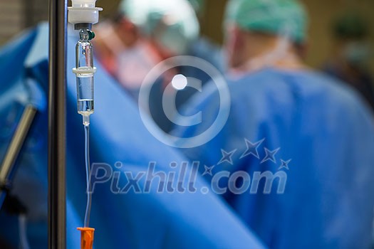 Unidentified boy undergoing a surgery. Focus on the monitor with vital functions